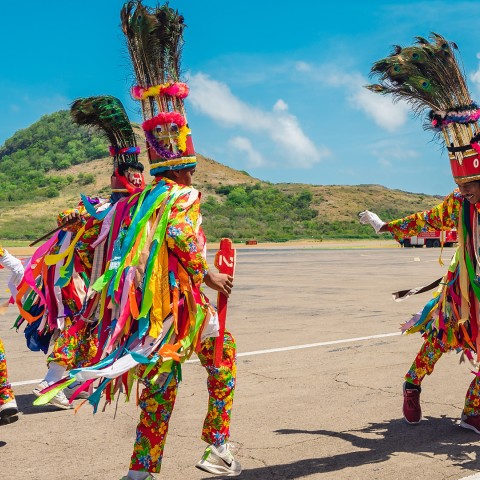 a group of people wearing colorful clothing