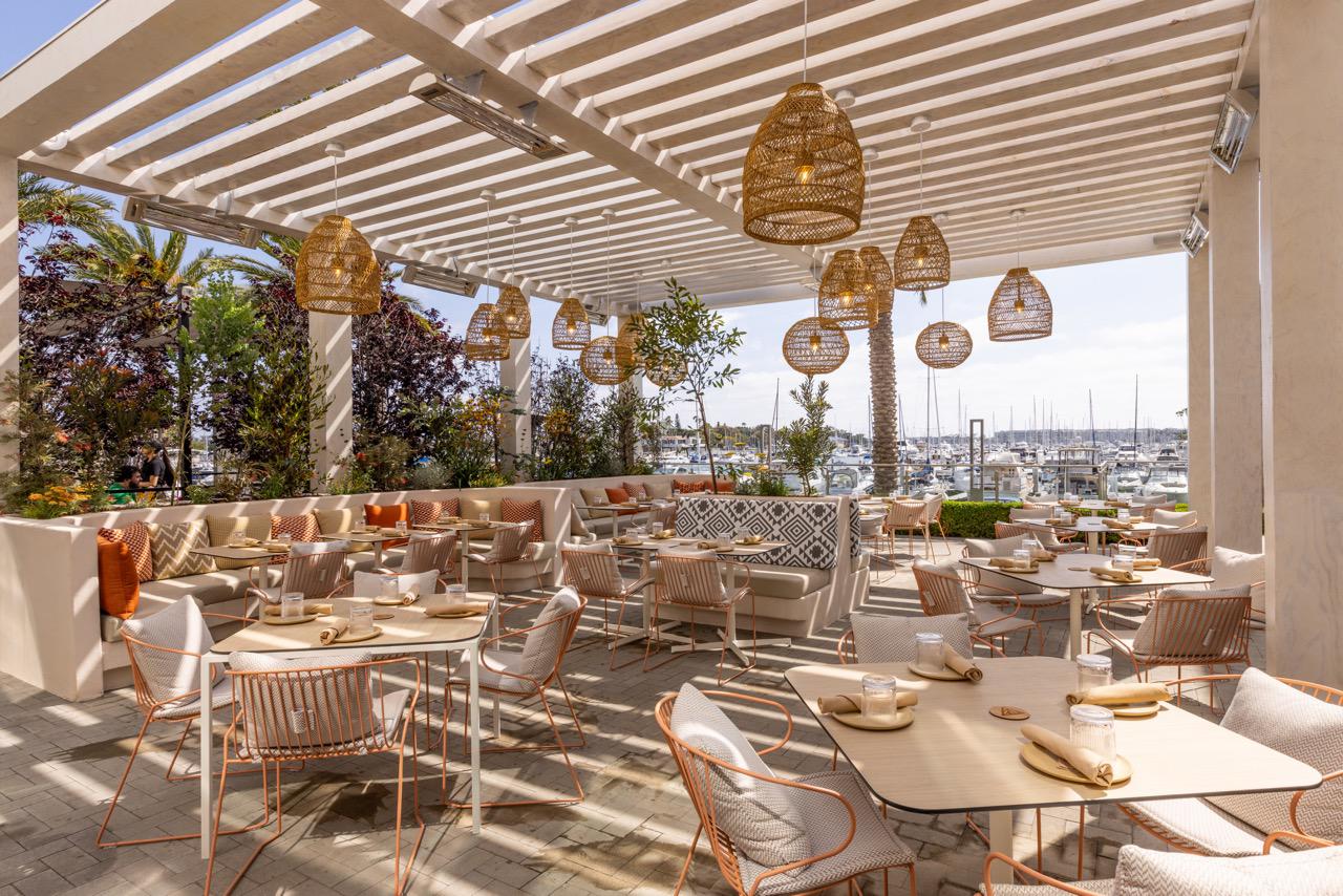 a outdoor restaurant with tables and chairs