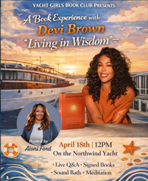 a woman leaning against a table with a book