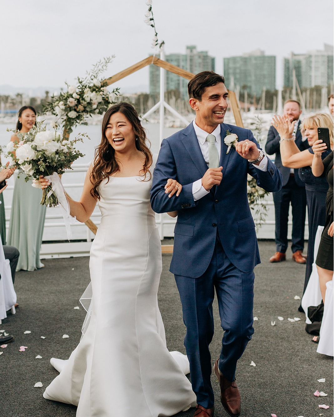 a man and woman walking down a dock