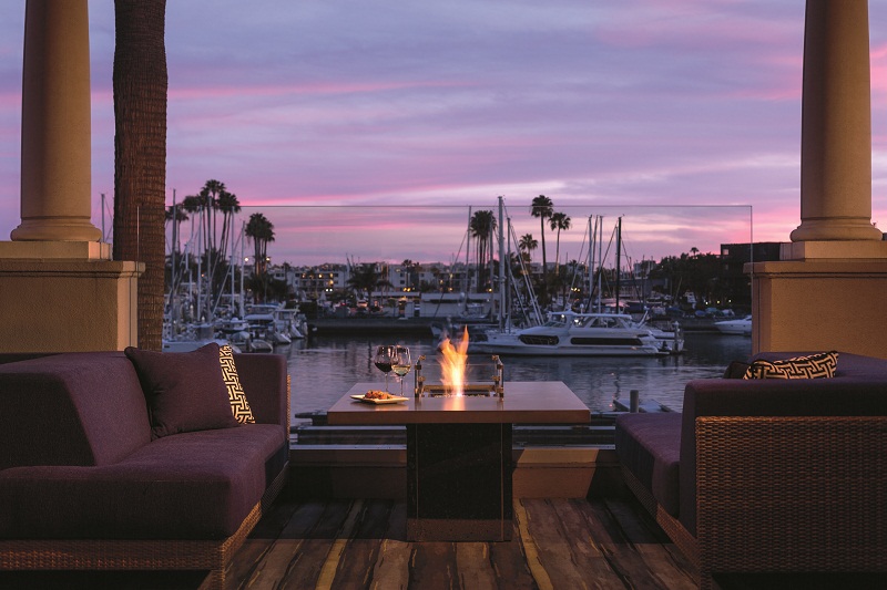 a fire pit with a plate of wine and a plate of wine on it