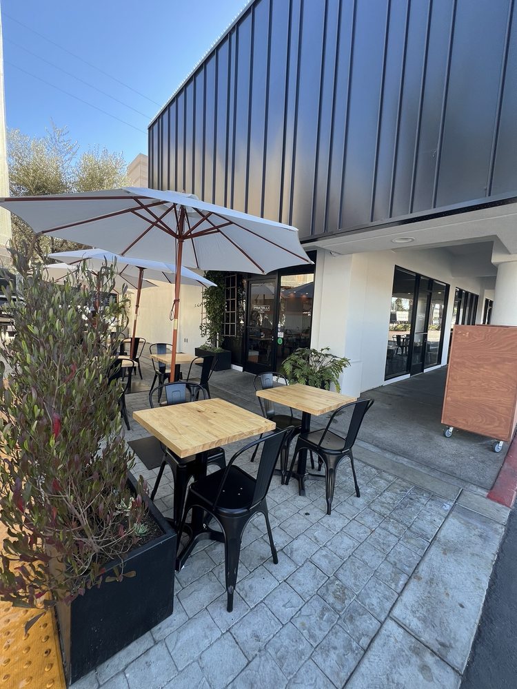 a table and chairs outside of a building