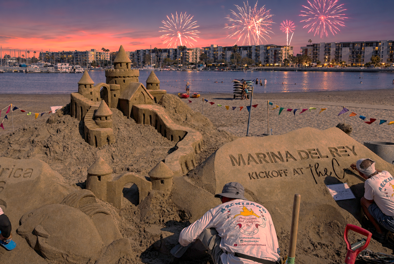 a man building a sand castle on a beach