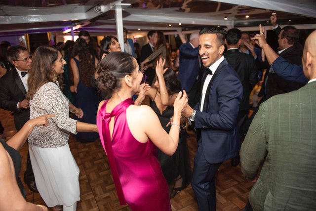 a group of people dancing in a room