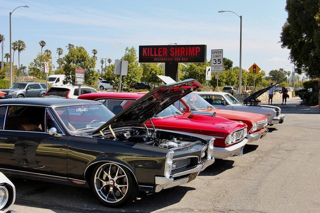 a group of cars parked in a parking lot
