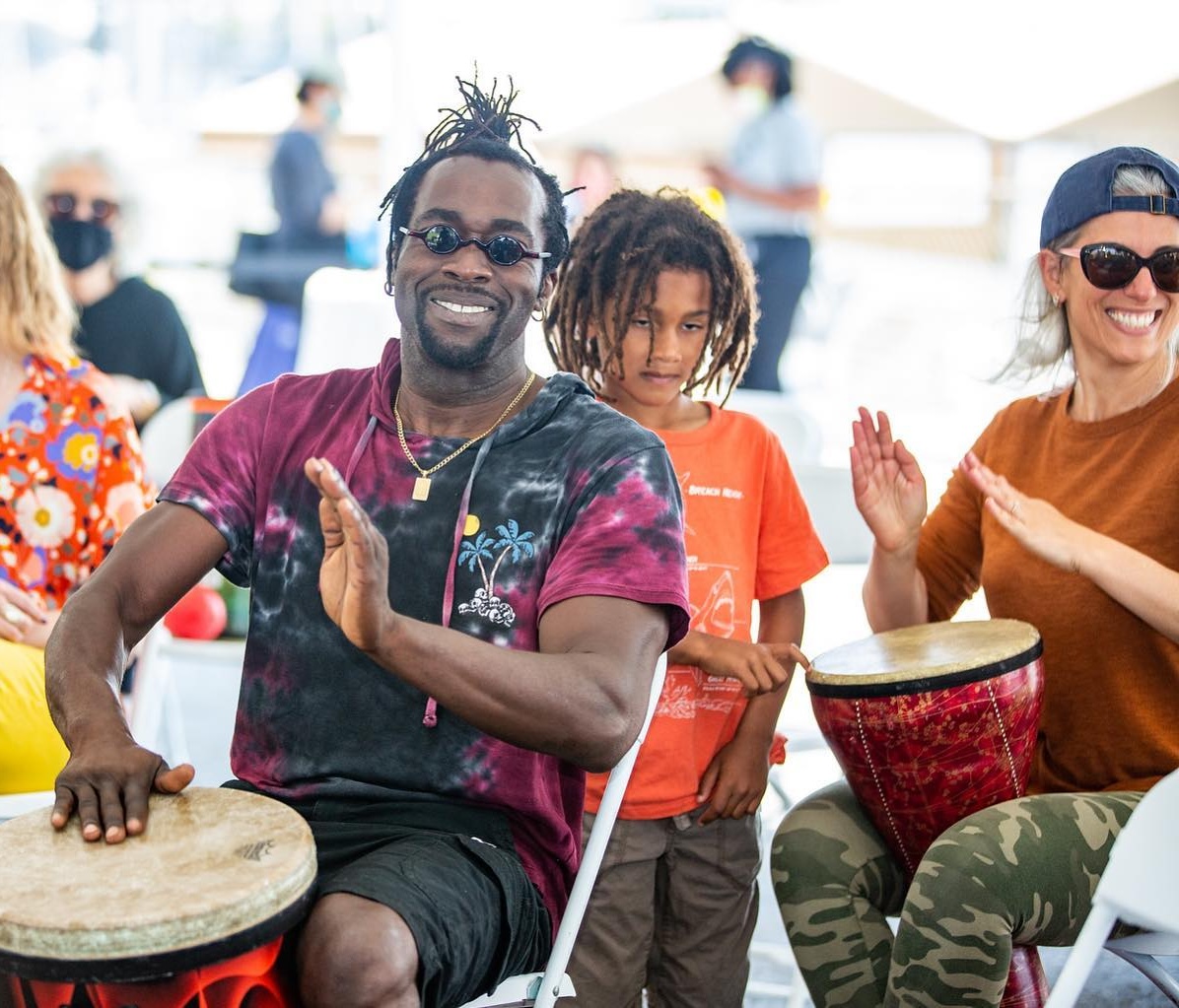a group of people playing drums