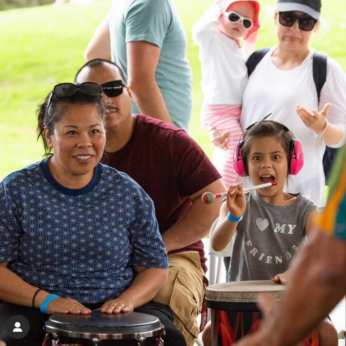 a group of people playing drums