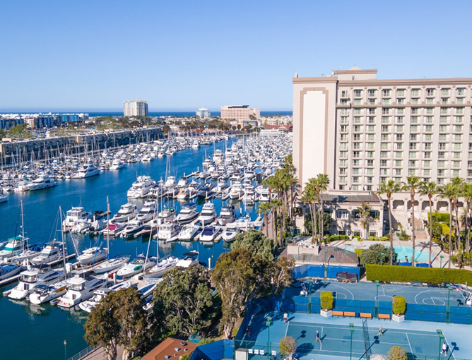 a marina with many boats and a swimming pool
