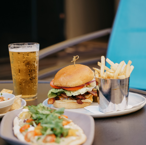 a burger and fries on a table