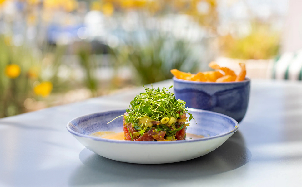 a plate of food and a bowl of fries