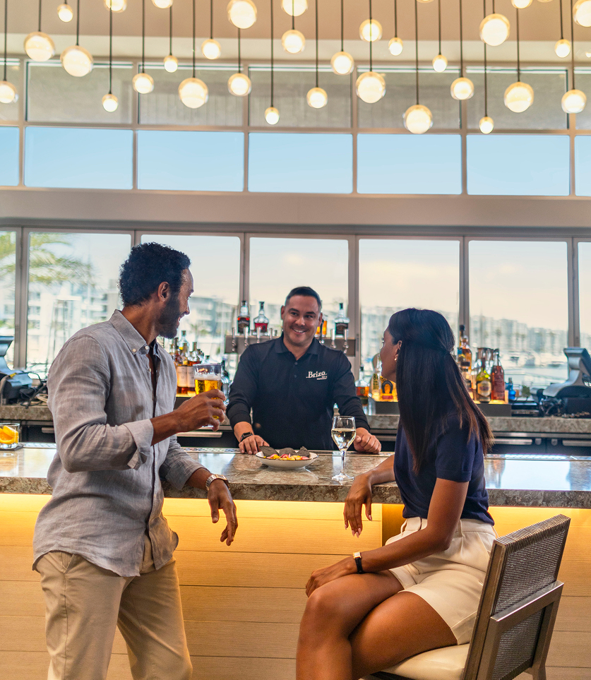 a group of people sitting at a bar
