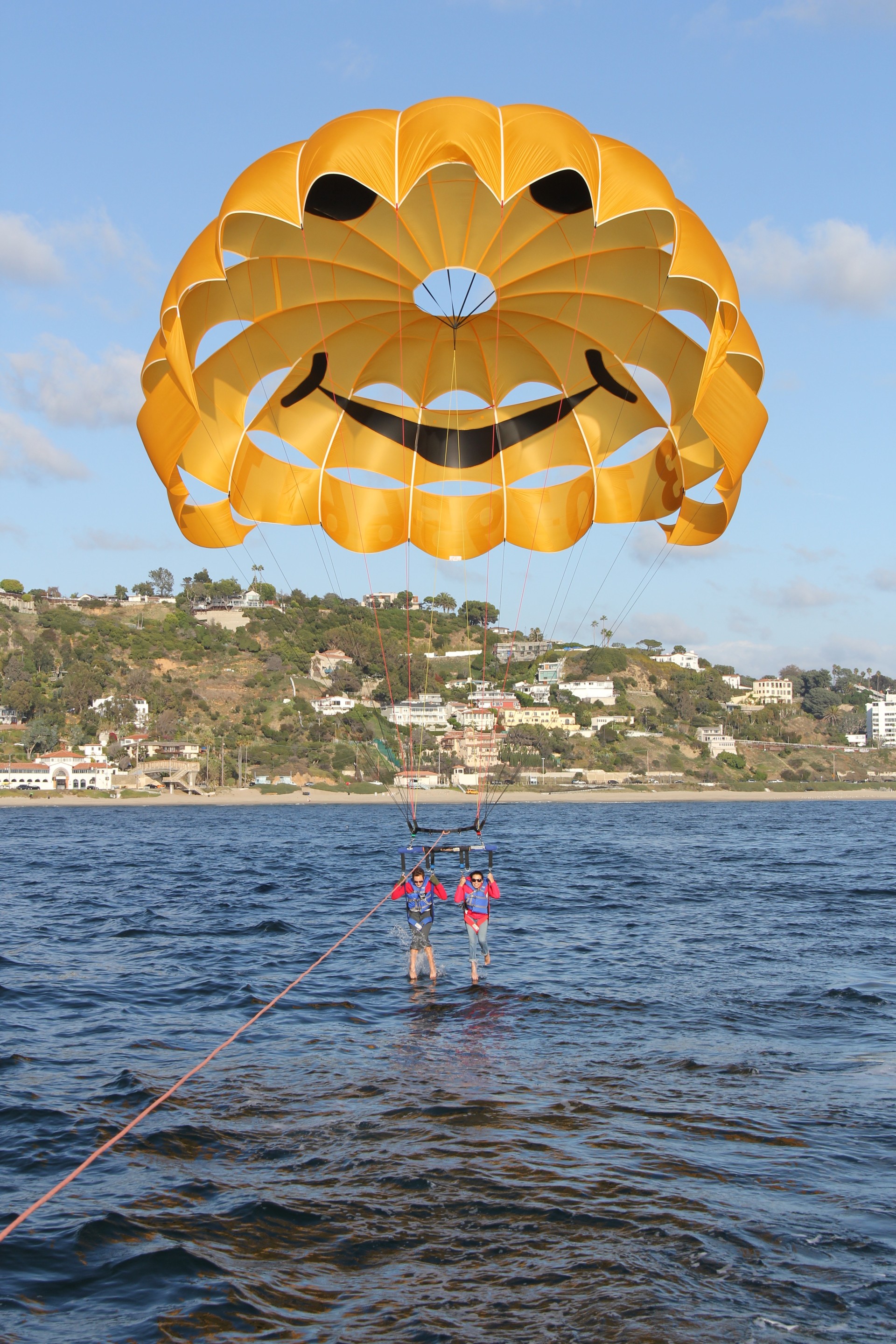 people parasailing in the water