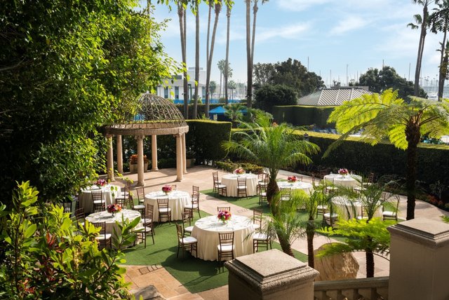a group of tables and chairs in a courtyard