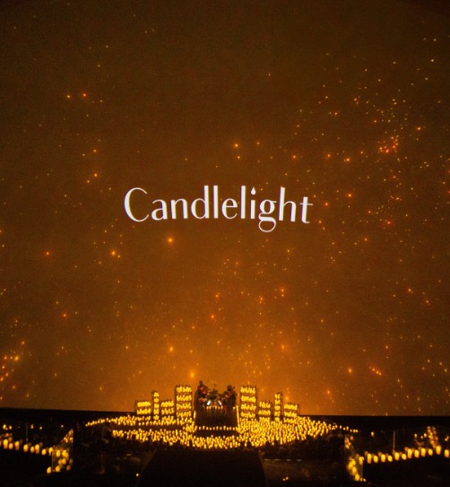 a lit up area with a group of candles