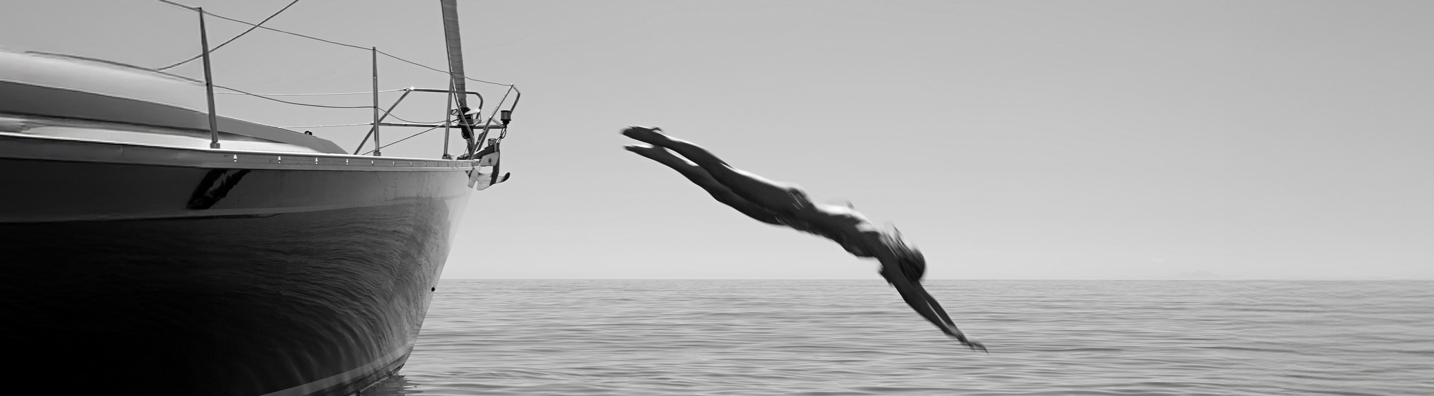 a woman diving into the water