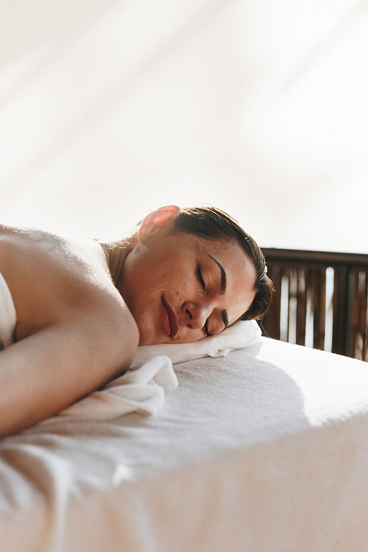 a woman lying on a massage table