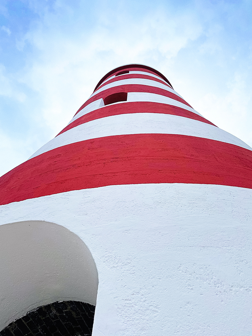 a red and white striped tower
