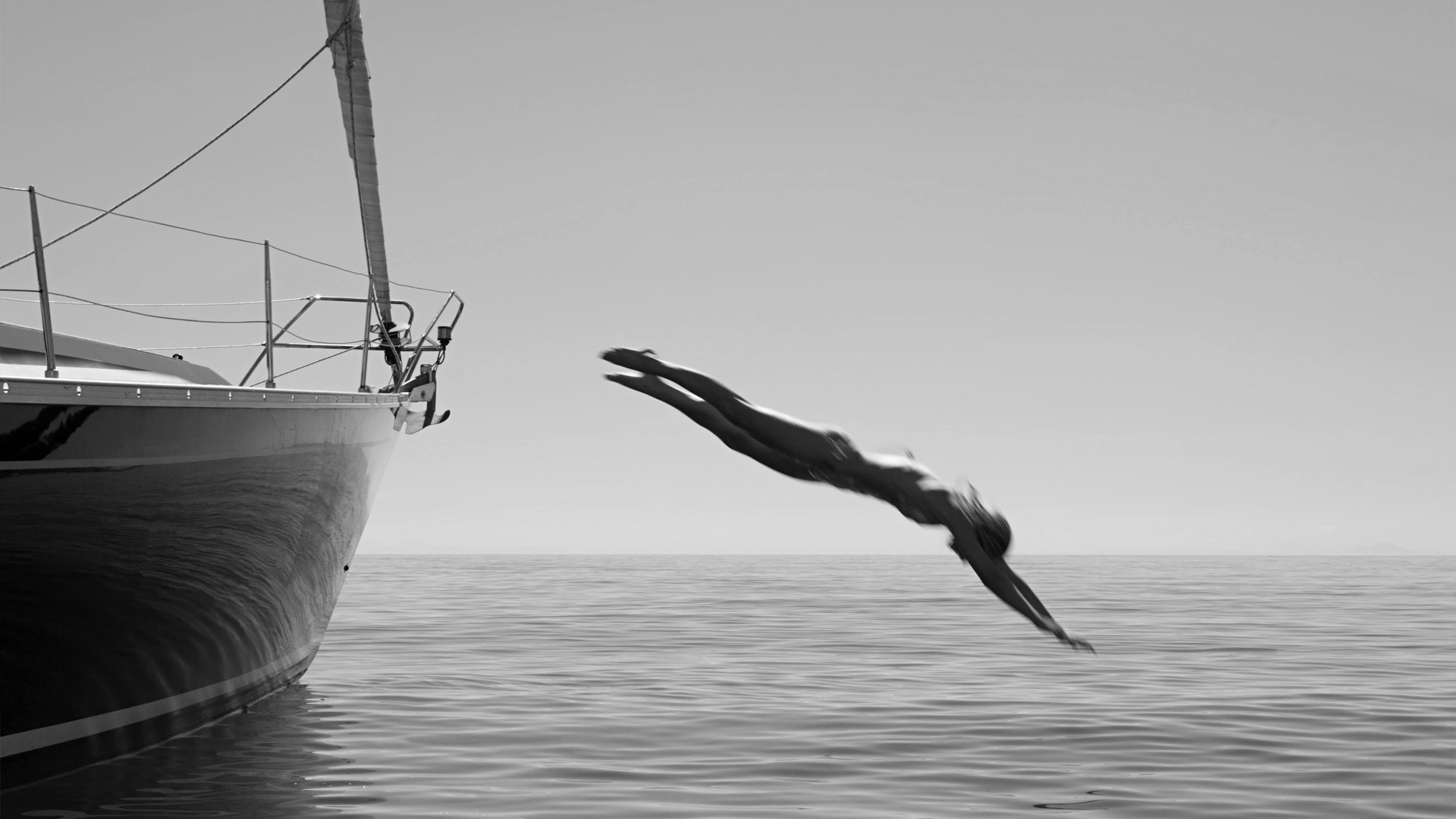 a woman diving into the water