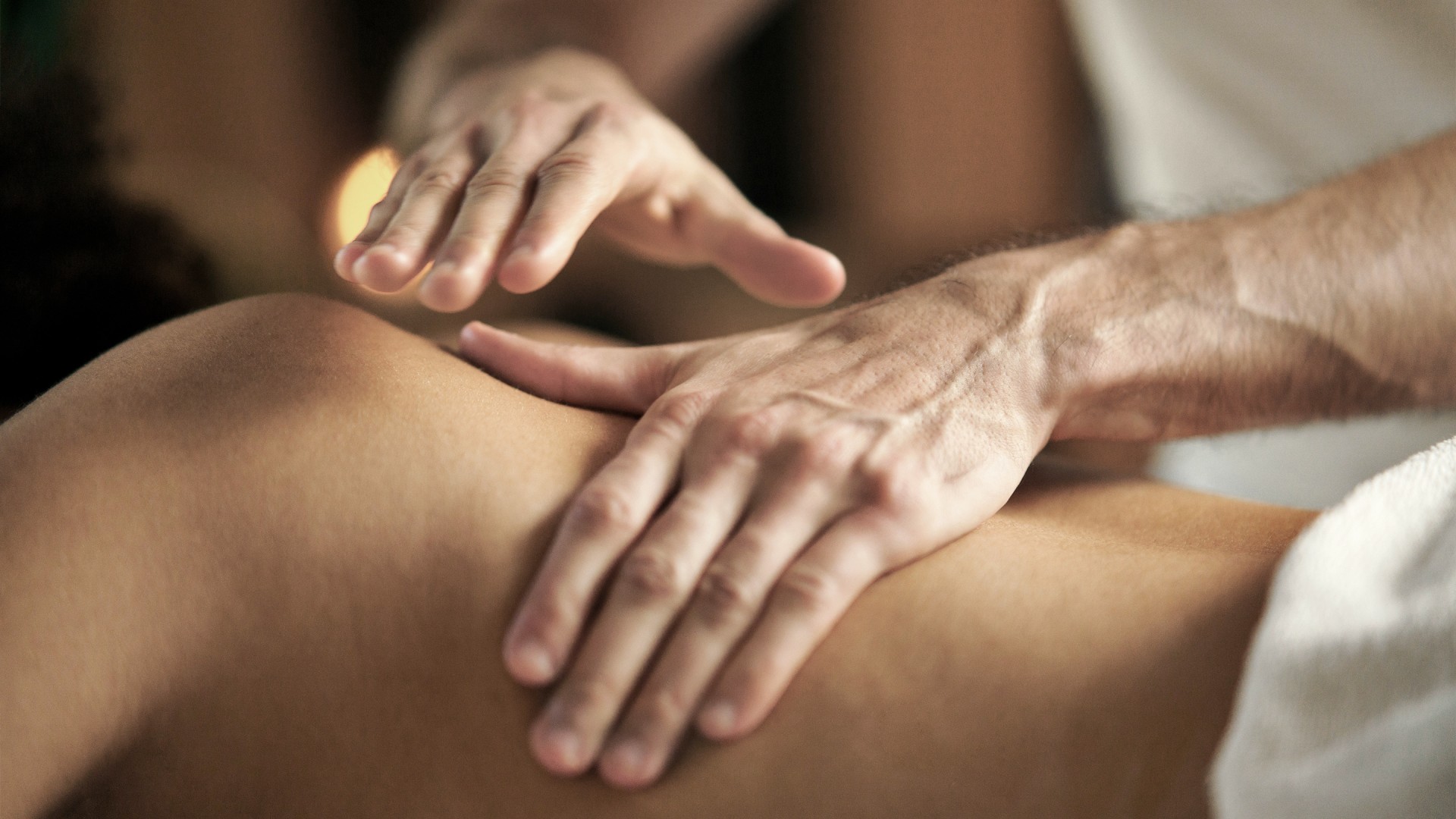 a person receiving a back massage
