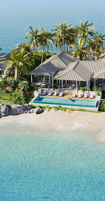 a house with a pool and palm trees