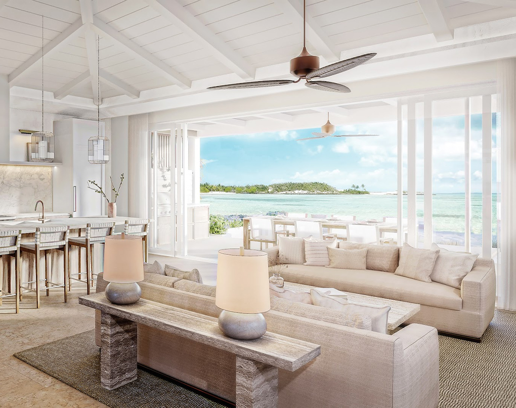 a living room with a large table and couches