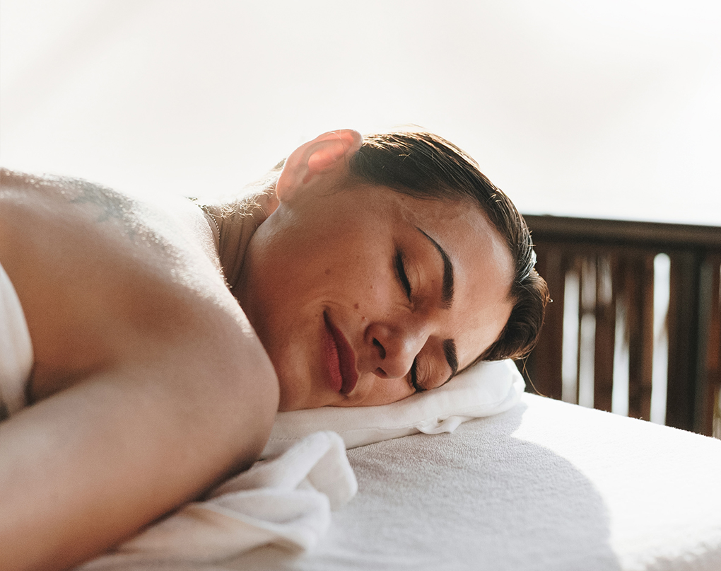 a woman lying on a towel