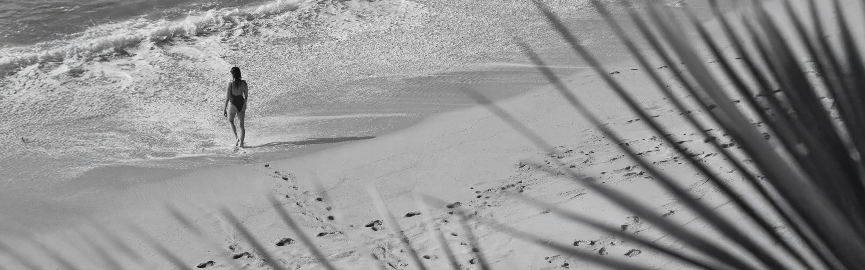 a snow covered hill with footprints
