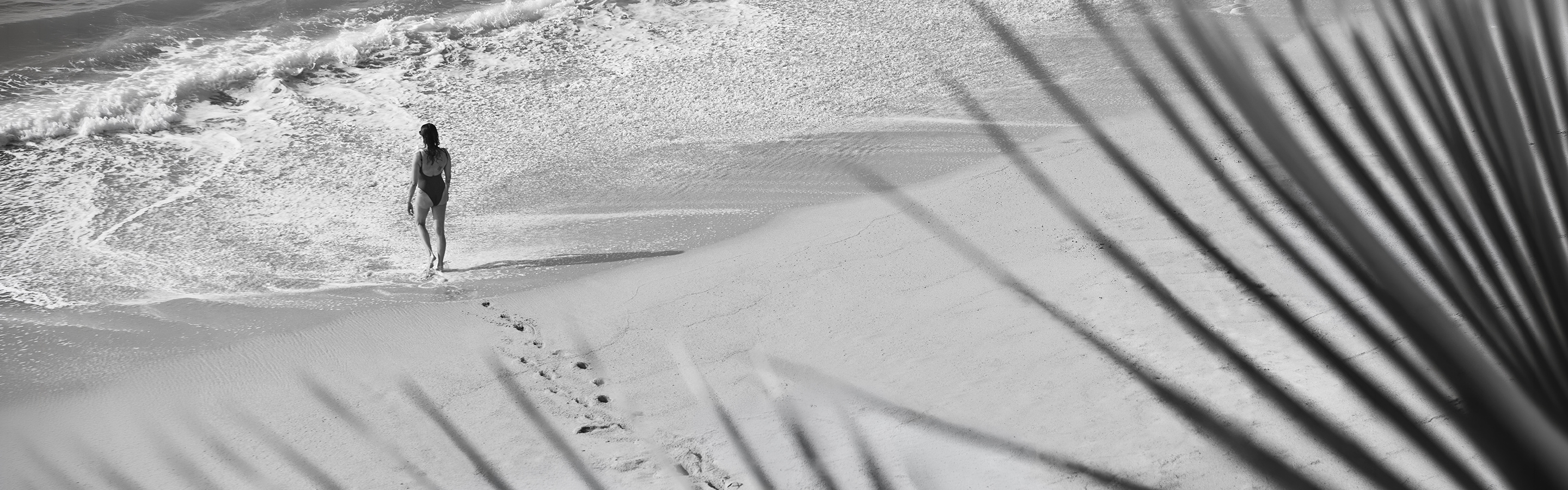 a snow covered ground with footprints