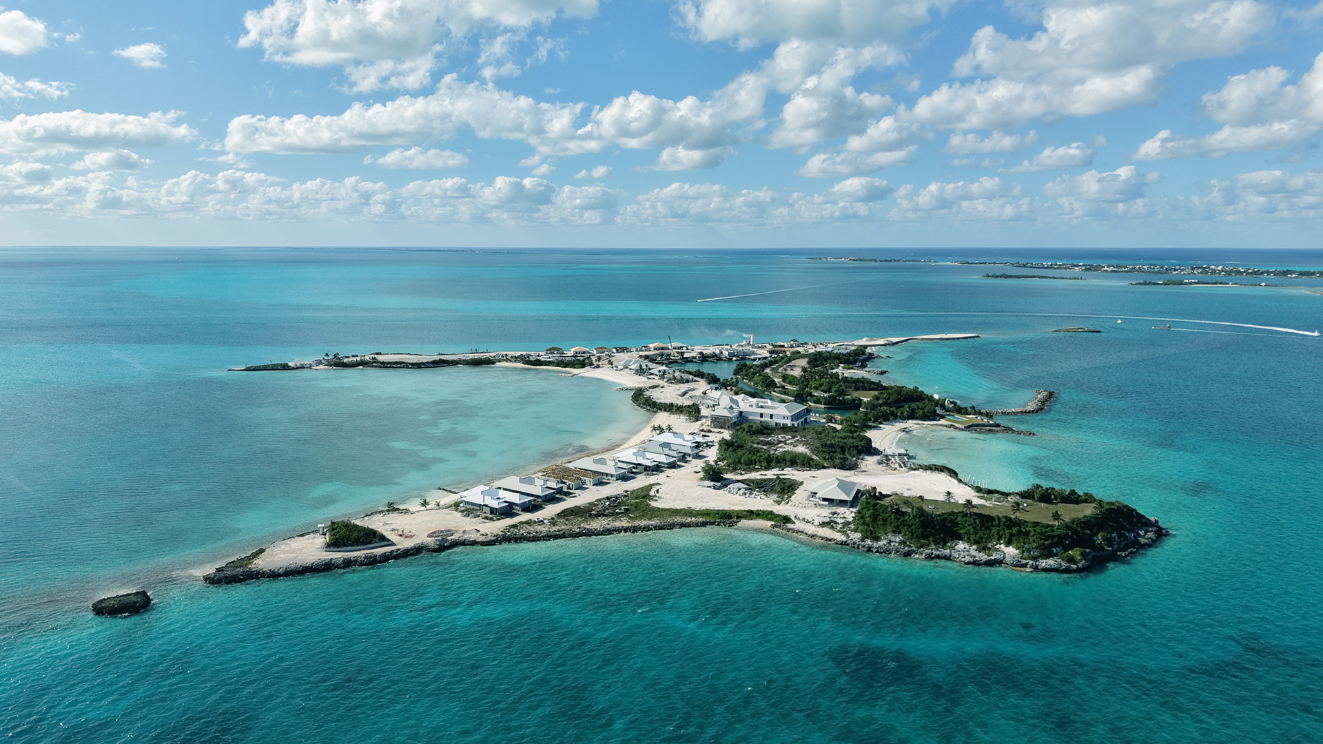 an island with buildings and a body of water