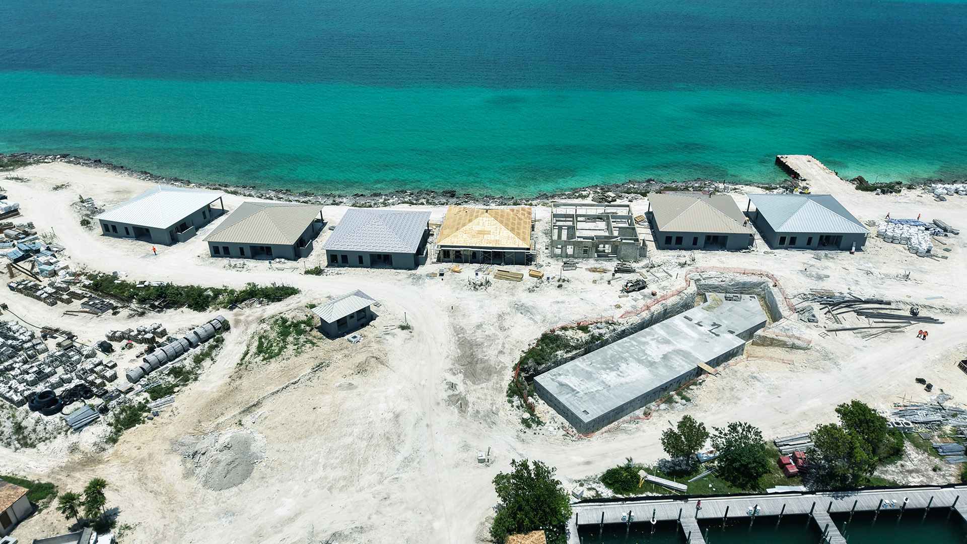 a group of buildings next to a body of water