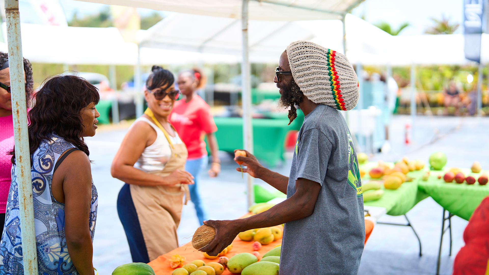 a man standing at a fruit stand