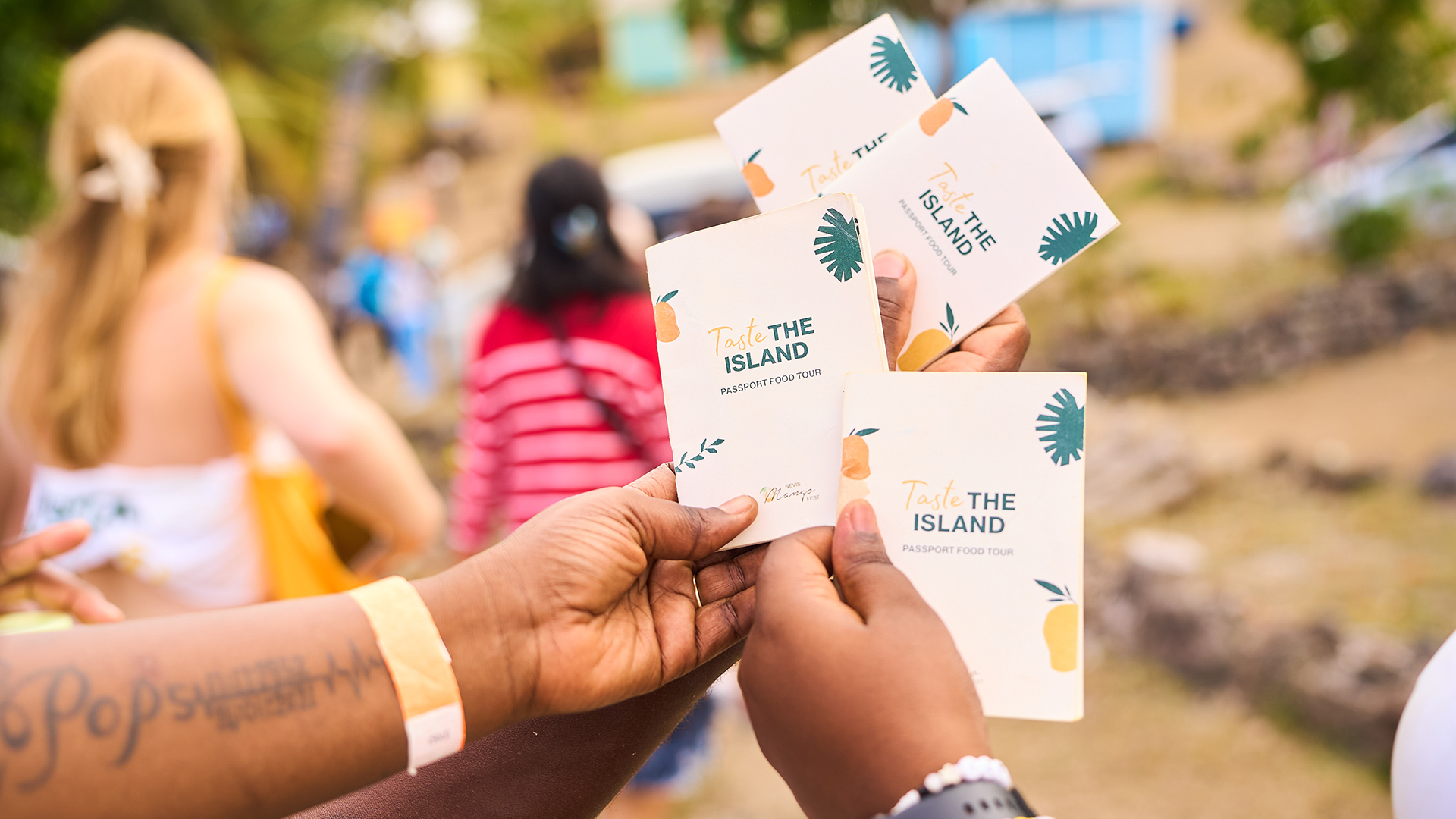 a group of hands holding small cards