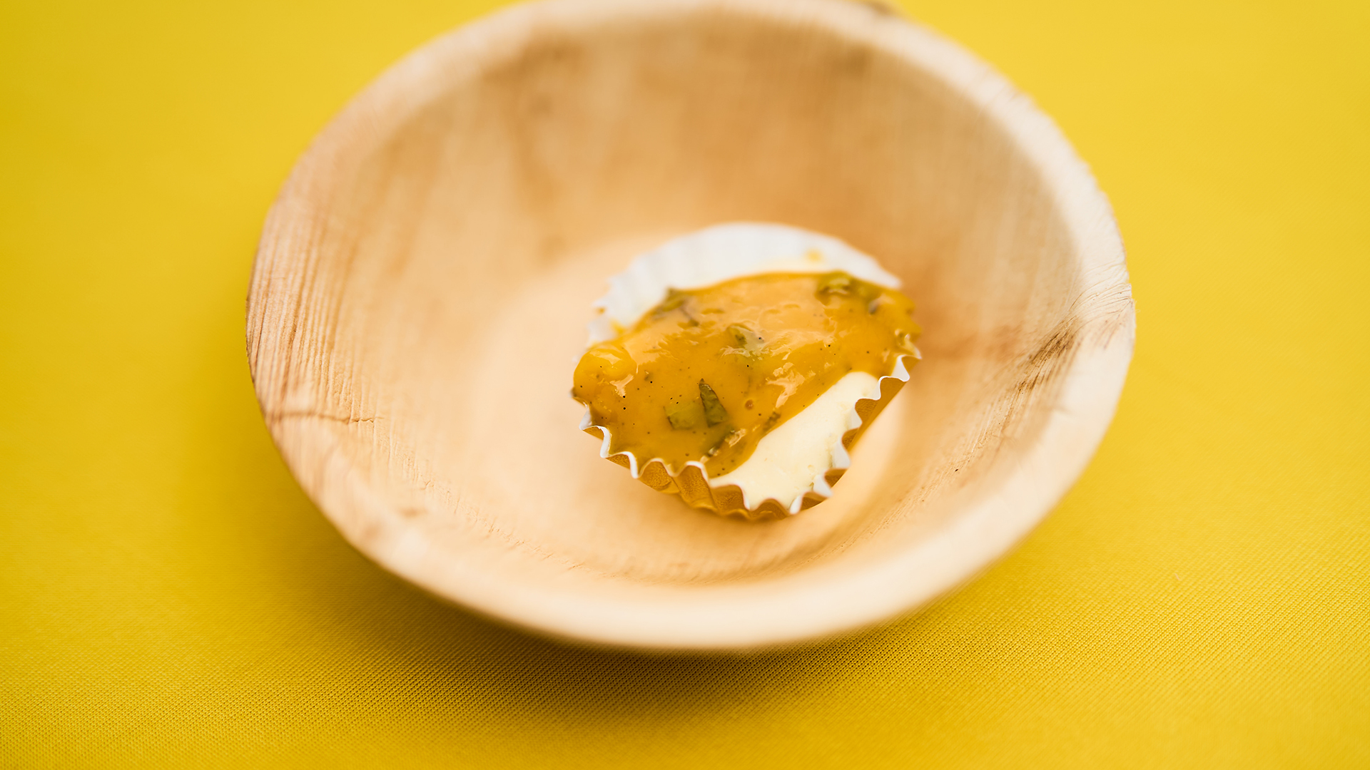 a small cupcake in a wooden bowl