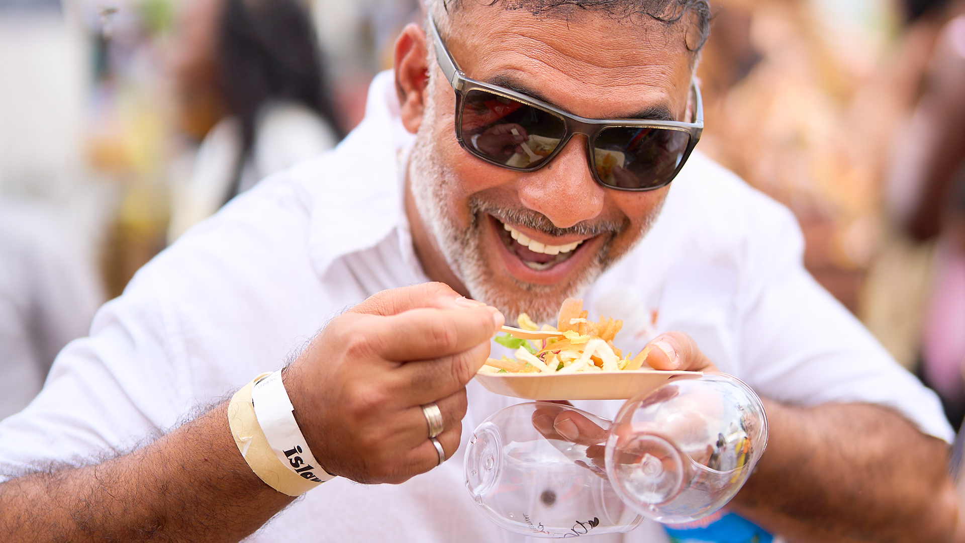a man eating food from a plate