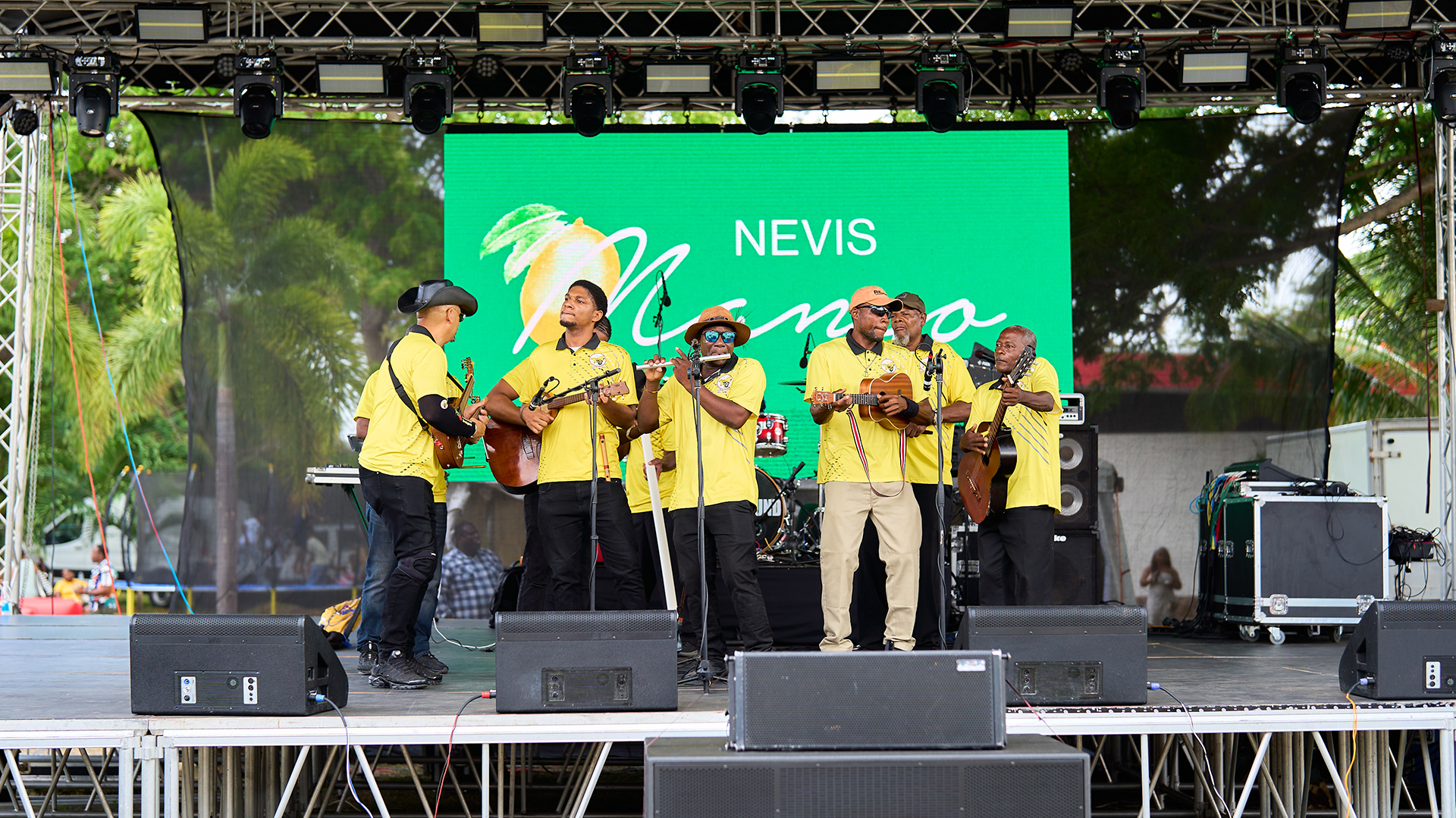 a group of men playing instruments on a stage