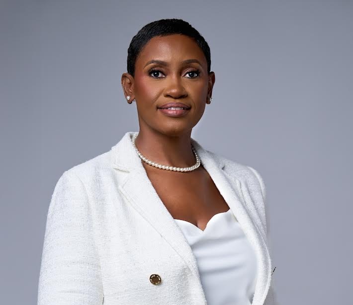 a woman in a white suit