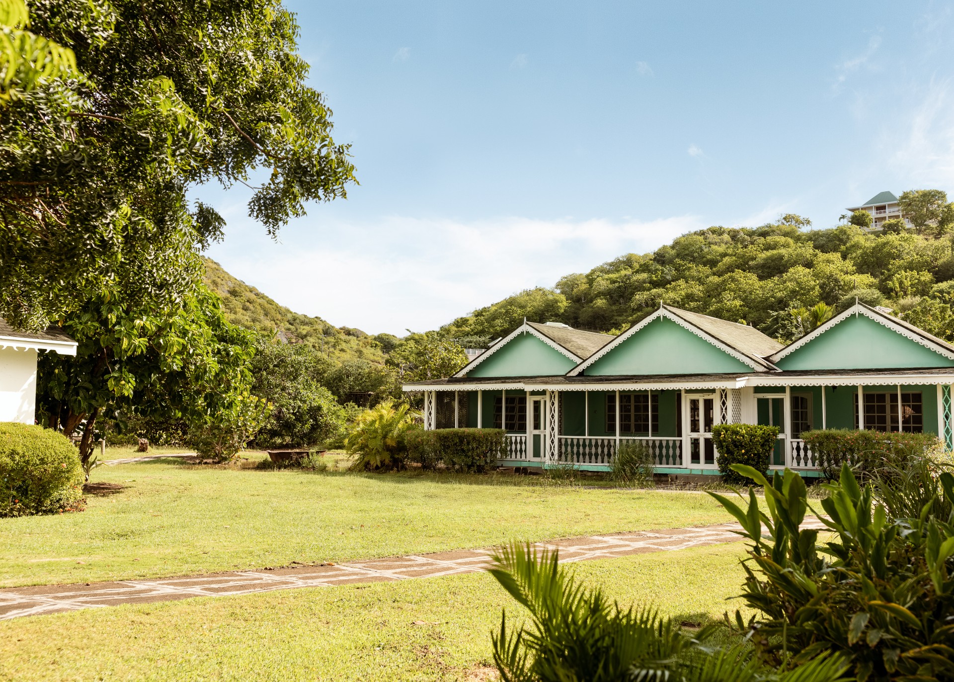 a house with trees and grass