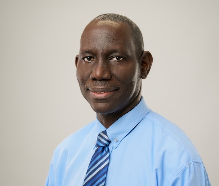 a man in a blue shirt and tie