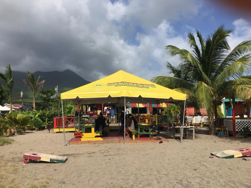 a yellow tent on a beach