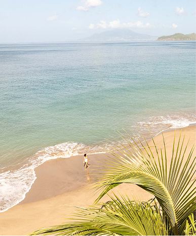 a person walking on a beach