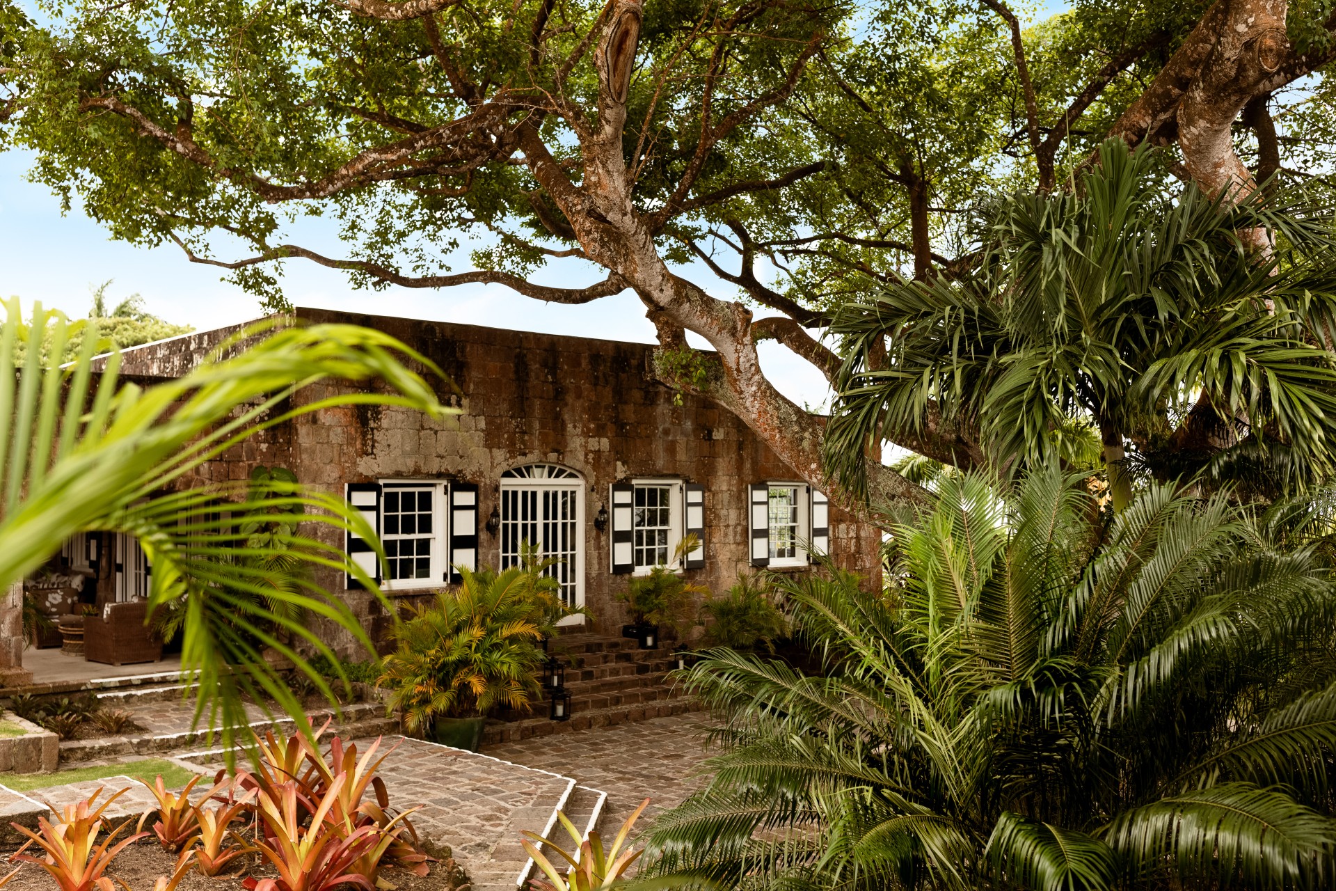a building with trees and plants around it