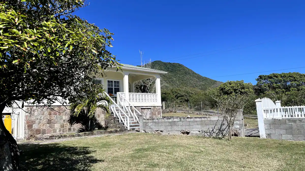 a house with a hill in the background