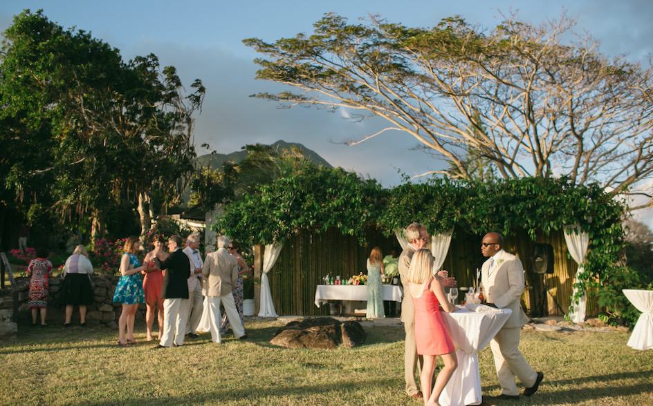 a group of people standing around a table
