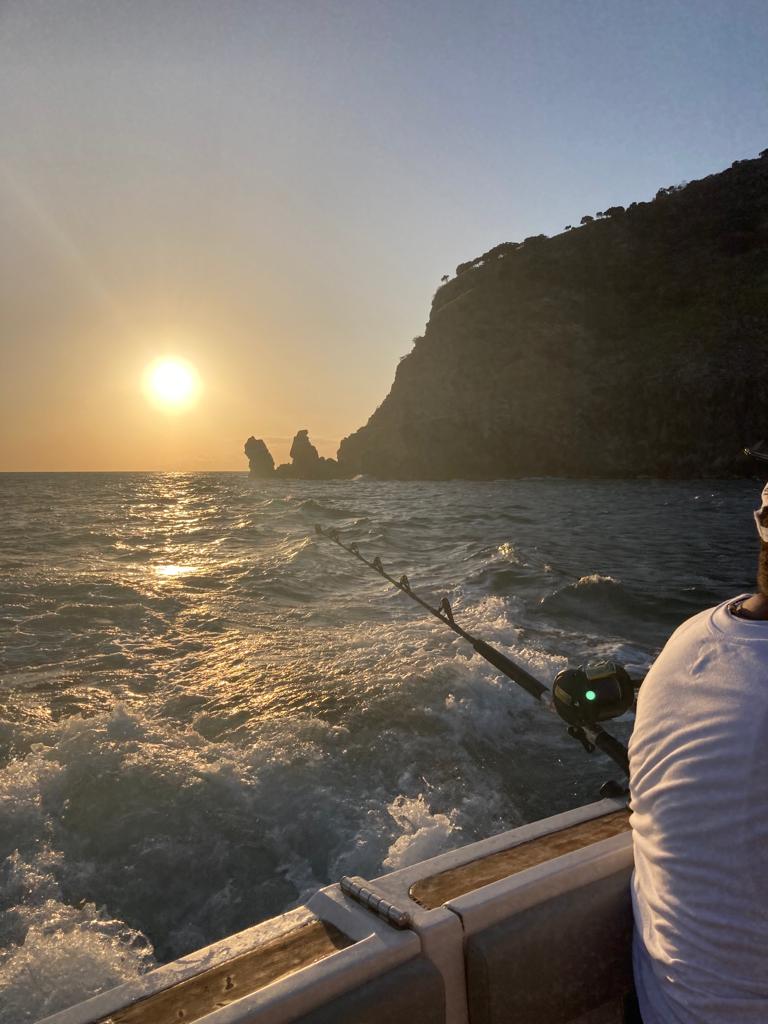 a person fishing on a boat