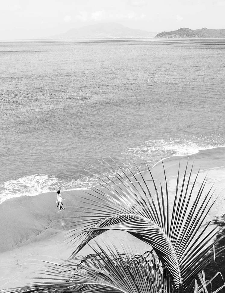 a person walking on a beach