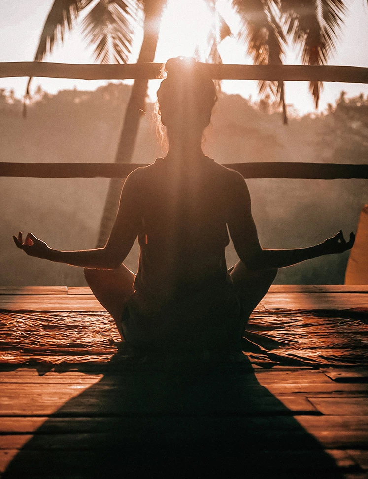 a woman sitting in a yoga pose