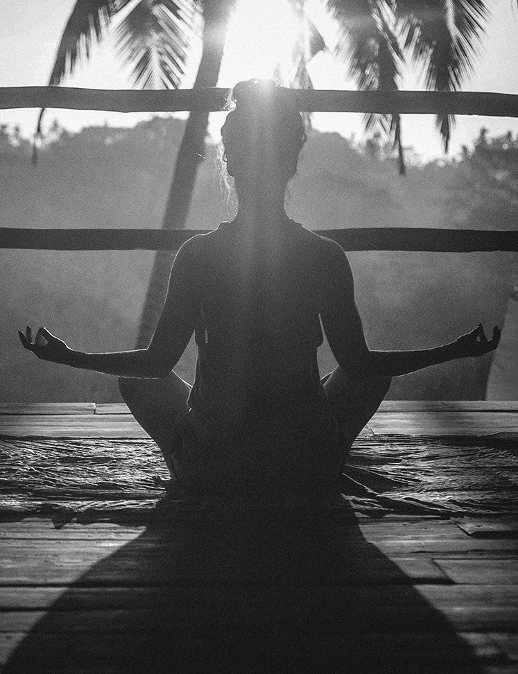 a woman sitting in a yoga pose