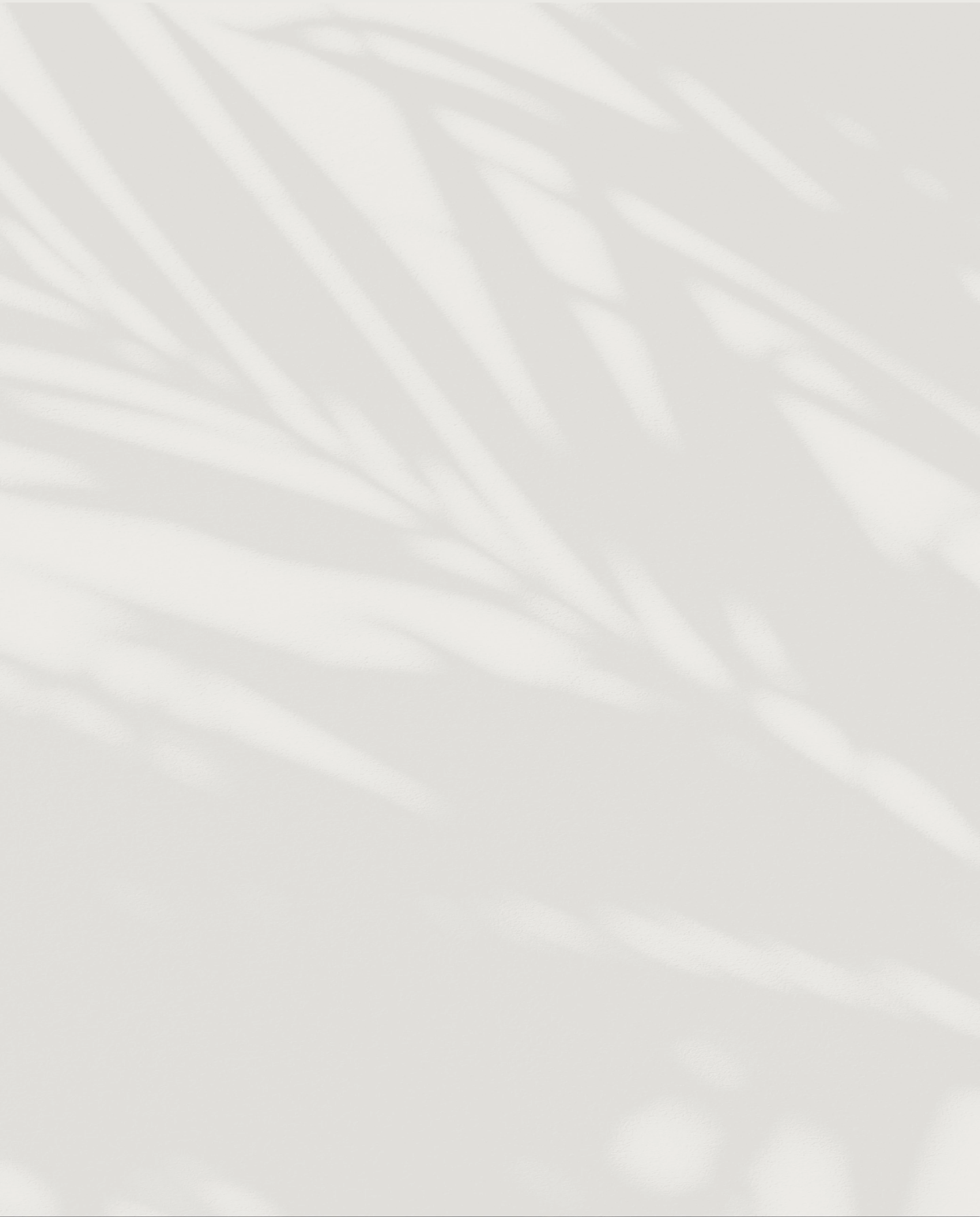 a white surface with shadows on it