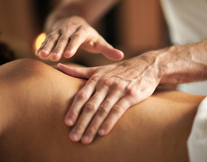 a person receiving a back massage