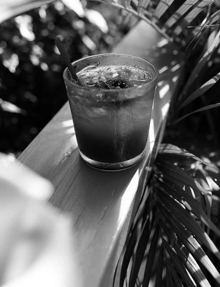 a drink on a railing